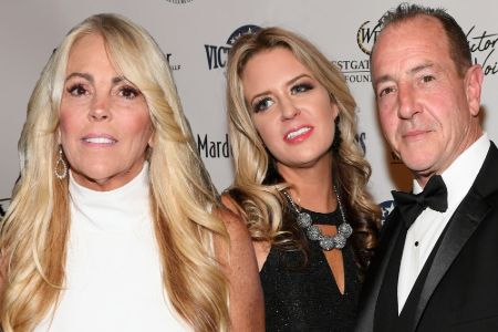 michael and kate in black outfit posing in a red carpet, dina's picture in a white sleeveless gown photoshopped into the frame 